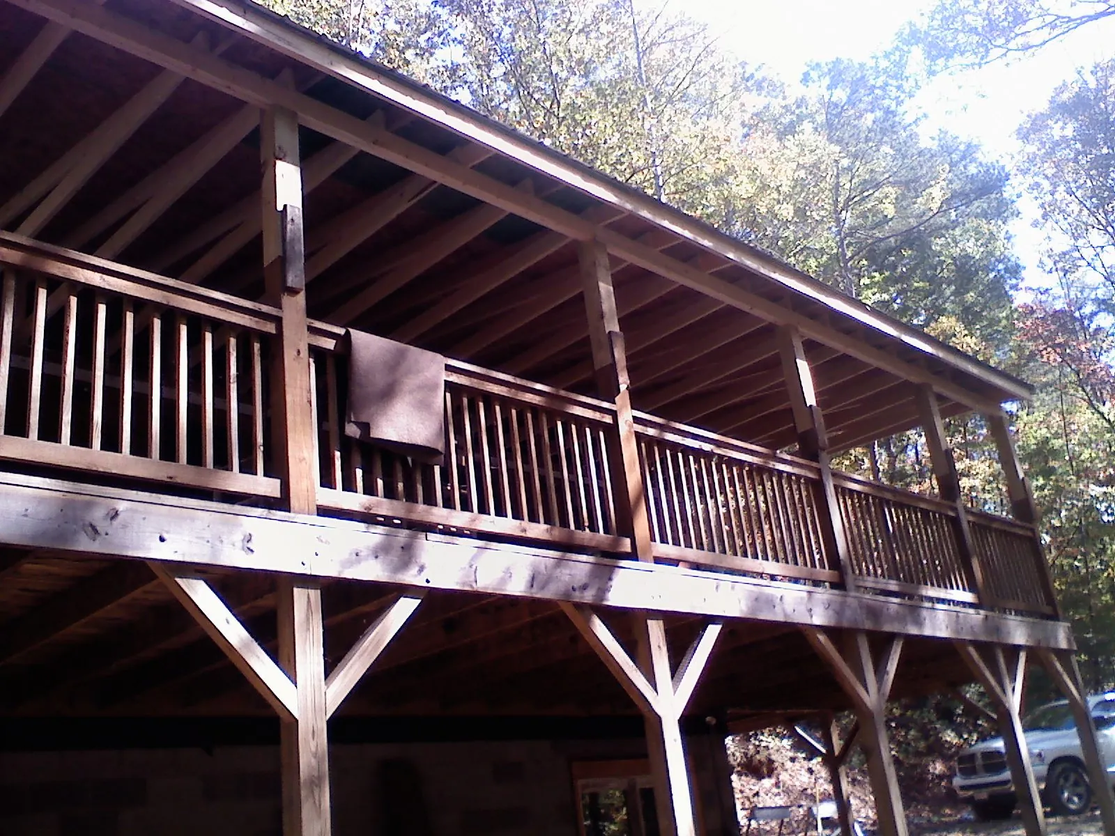 Timber framing under a new elevated porch and deck — Roof Leak Repair in Watkins by Roofing Brothers